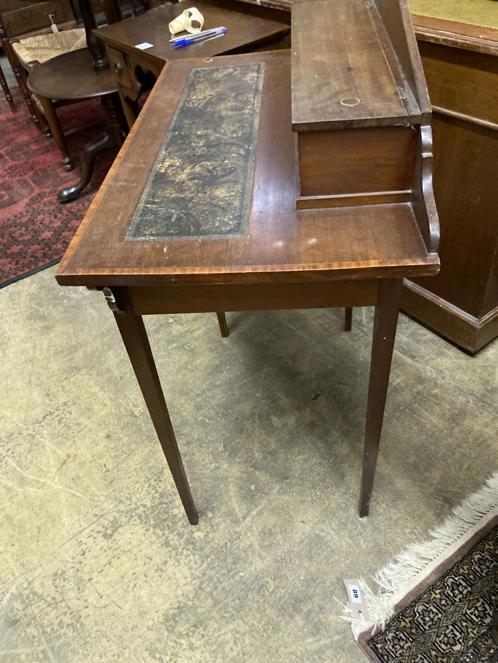 An Edwardian satinwood banded mahogany writing table, width 76cm depth 42cm height 93cm